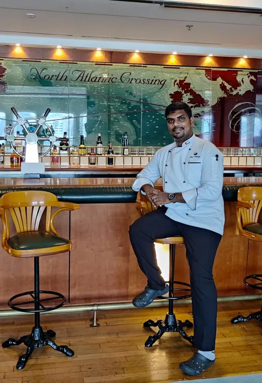 Chef seated at a hotel bar