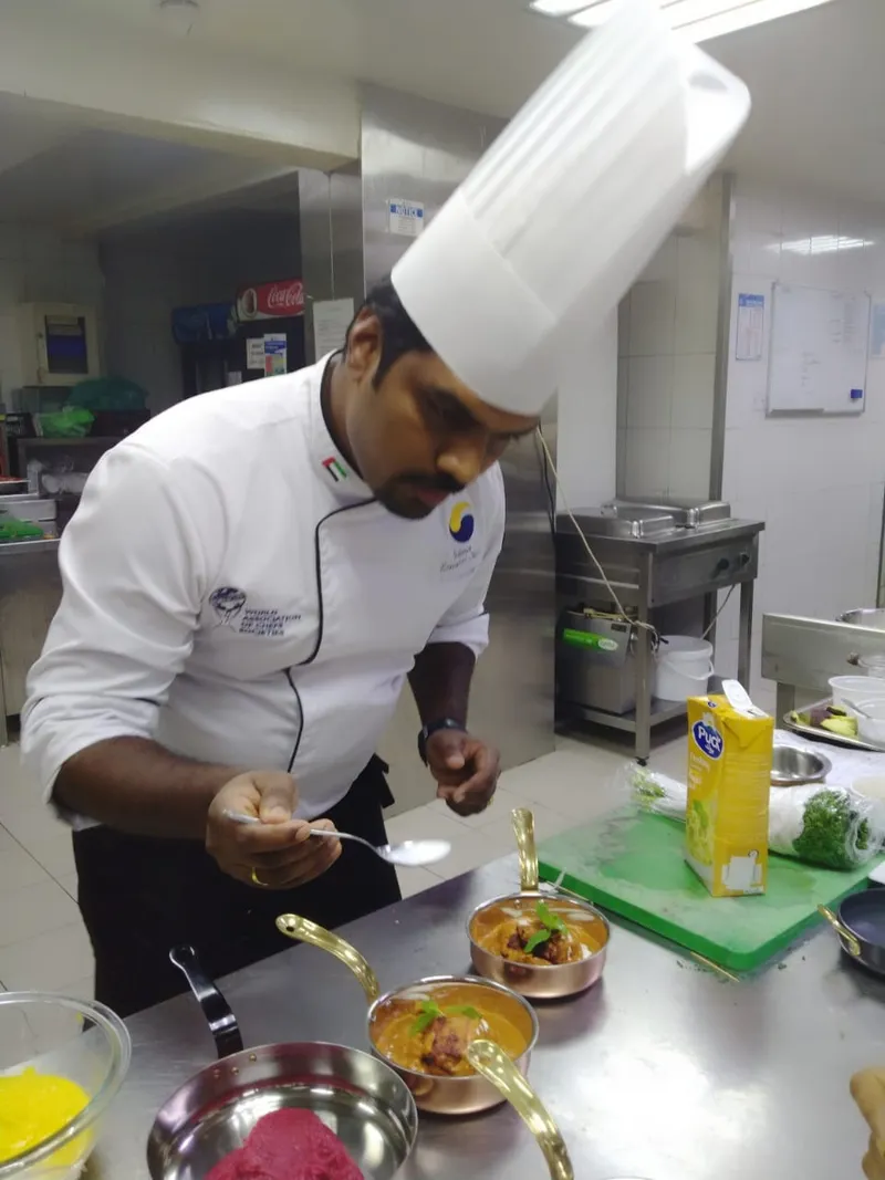 Chef preparing dishes in a professional kitchen
