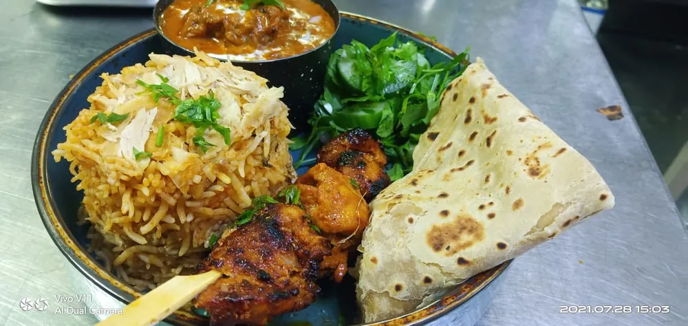 Biryani, grilled meat and flatbread platter