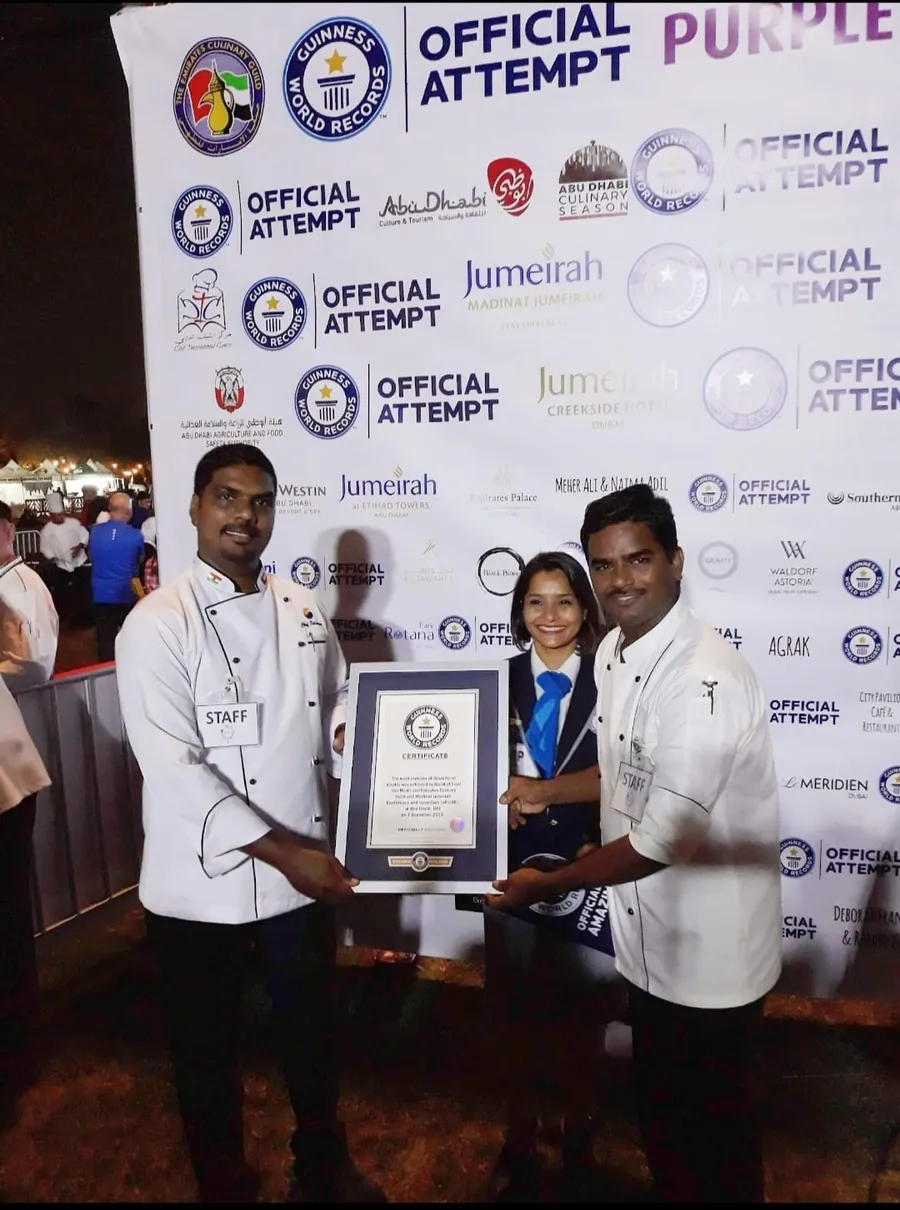 Chefs holding the Guinness World Records certificate at the record event in Abu Dhabi