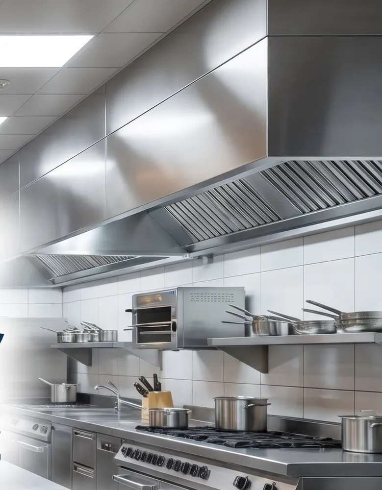 Clean stainless-steel commercial kitchen with range and extraction